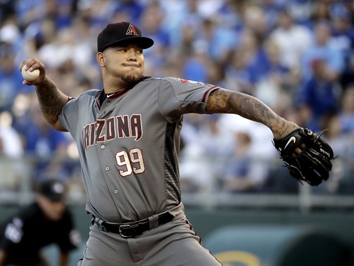 In this Sept. 30, 2017, file photo, Arizona Diamondbacks starting pitcher Taijuan Walker throws during the first inning of a game against the Kansas City Royals in Kansas City, Mo. Walker will start Arizona’s NL Division Series opener against the Dodgers after the craziness of the Diamondbacks’ wild-card game depleted their pitching staff. (Charlie Riedel, File/AP, File)