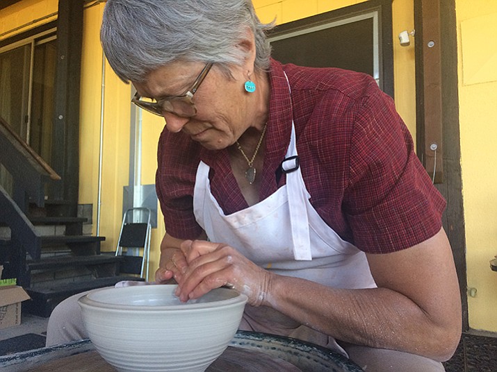 Abby Brill works on a piece of pottery at her studio on Friday, Oct. 6, during the Prescott Area Artists’ Studio Tour, which continues today, Oct. 8.