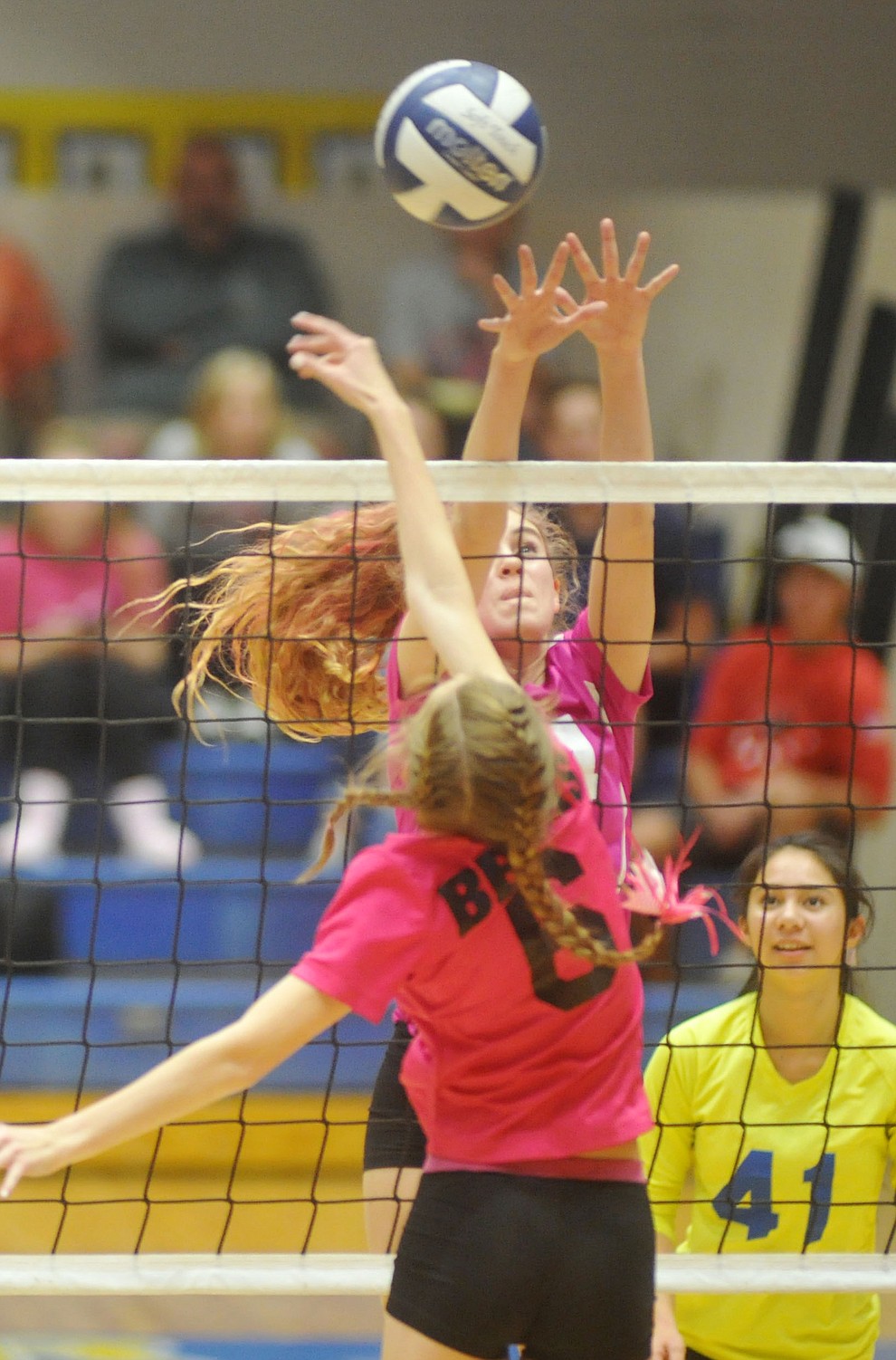 Prescott's Daphne Skinner (14) blocks Nikala Calia (6) as the Badgers hosted crosstown rival Bradshaw Mountain in volleyball Monday night. (Les Stukenberg/Courier)