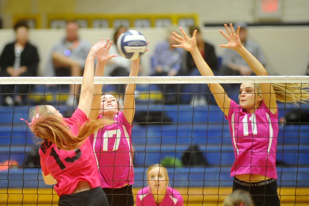 Prescott's McKella Wright (17) and Savanna James (11) go for the block on Jordyn Moser (13) as the Badgers hosted crosstown rival Bradshaw Mountain in volleyball Monday night. (Les Stukenberg/Courier)