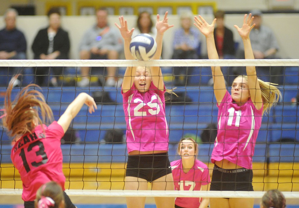 Prescott's Danielle Dreher (25 and Savanna James (11) get the block on Jordyn Moser (13) as the Badgers hosted crosstown rival Bradshaw Mountain in volleyball Monday night. (Les Stukenberg/Courier)