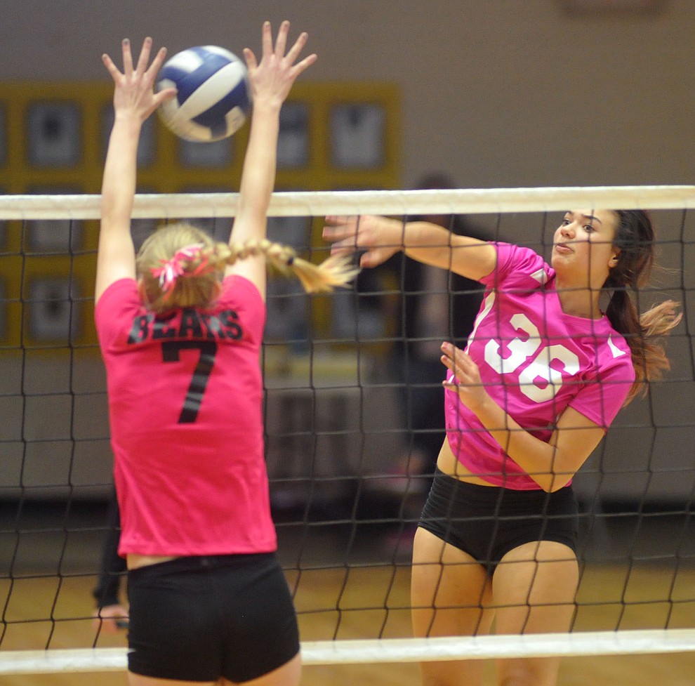 Prescott's Madison Wood (36) goes for a kill on Rylee Bundrick (7) as the Badgers hosted crosstown rival Bradshaw Mountain in volleyball Monday night. (Les Stukenberg/Courier)
