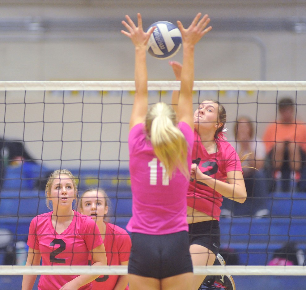 Bradshaw Mountain's Peyton Bradshaw (12) goes for a kill on Savanna James (11) as the Bears traveled to crosstown rival Prescott for a volleyball matchup Monday night. (Les Stukenberg/Courier)