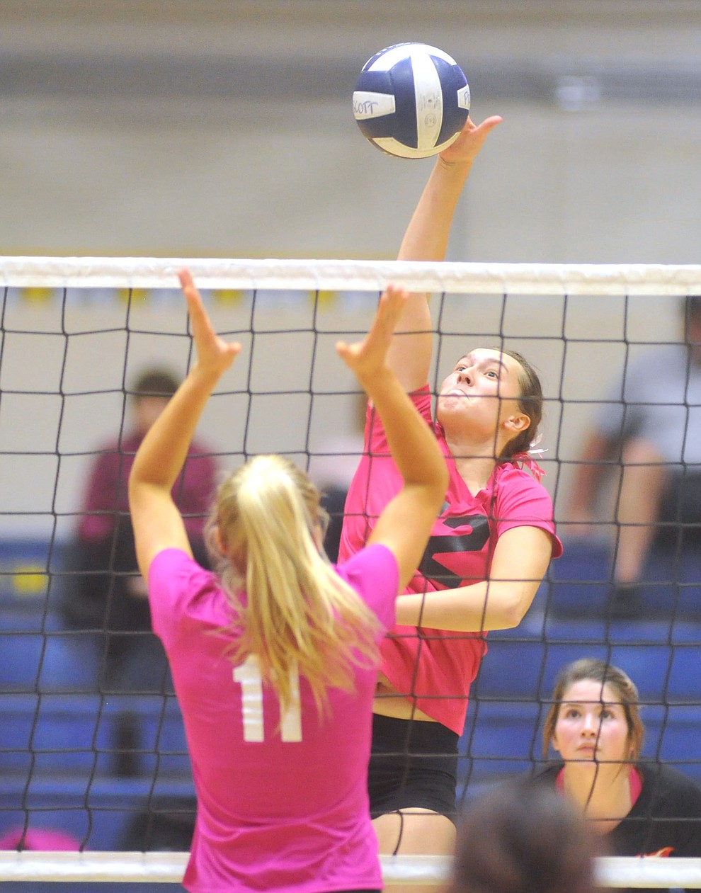 Bradshaw Mountain's Peyton Bradshaw (12) goes for a kill on Savanna James (11) as the Bears traveled to crosstown rival Prescott for a volleyball matchup Monday night. (Les Stukenberg/Courier)