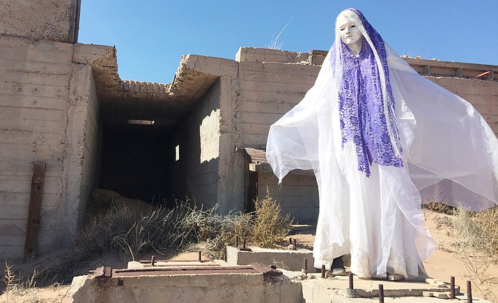 Pash Galbavy’s mask of Compassion at an open uranium mine along the Little Colorado River near Cameron. Photo by John Tannous