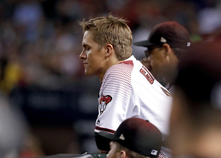 Arizona Diamondbacks starting pitcher Zack Greinke (21) watches from the dugout after being pulled from the game during the sixth inning against the Los Angeles Dodgers on Monday, Oct. 9, 2017, in Phoenix. (Rick Scuteri/AP)