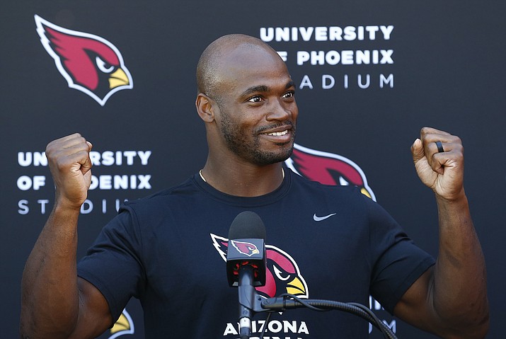 New Arizona Cardinals running back Adrian Peterson answers a question about being traded to the Cardinals during an NFL football news conference at the team’s training facility Wednesday, Oct. 11, 2017, in Tempe, Ariz. (Ross D. Franklin/AP)
