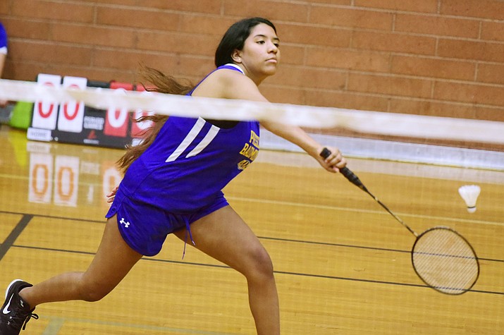 Prescott’s Zoey Frazier hits a backhand return as the Badgers take on Raymond Kellis in a badminton match Wednesday in Prescott. (Les Stukenberg/Courier)