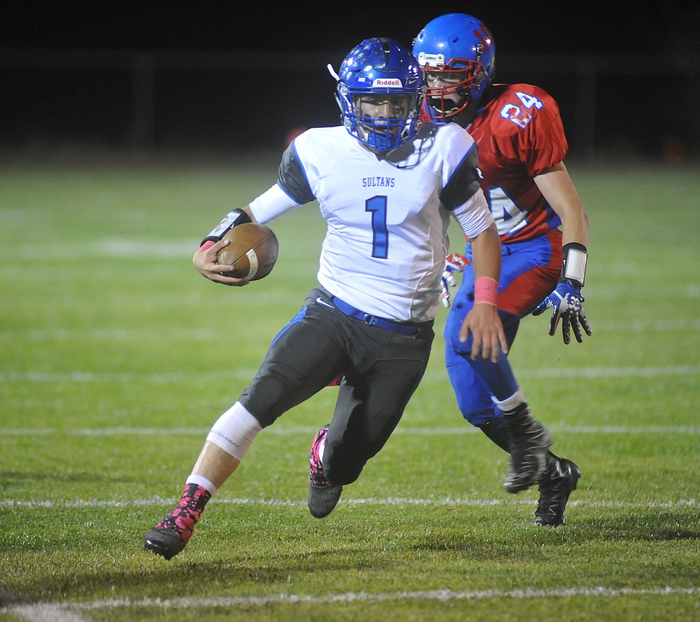 Bagdad quarterback Israel Loveall (1) breaks into the open field as the Sultans faced the Mayer Wildcats Friday night in a matchup of top 4 teams in the AIA 1A rankings in Mayer. (Les Stukenberg/Courier)