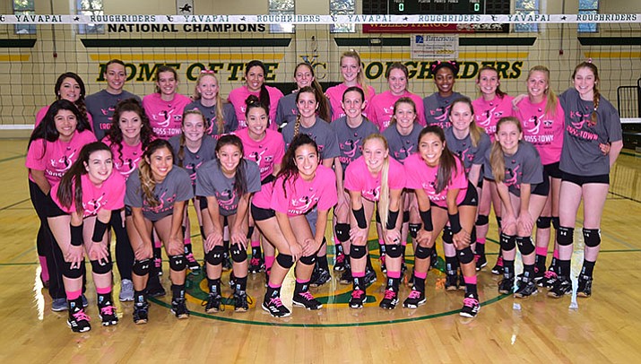 Yavapai and ERAU players gather for a group photo before the Battle Against Breast Cancer volleyball game Wednesday night, Oct. 4, at Yavapai College in Prescott. (Les Stukenberg/Courier)