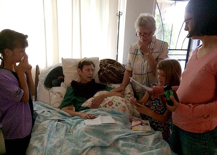 At end of life moments, patients and family members value time together to express their love and their goodbyes in words, and here in the case of children, in drawings and stories. (Sue Tone/Courier)
