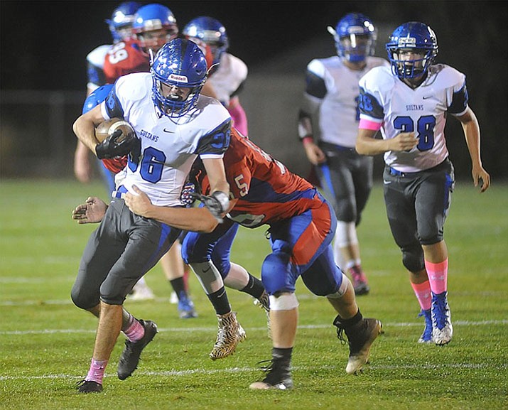 Bagdad's Rio Delgado (36) runs after a catch as the Sultans faced the Mayer Wildcats Friday night, Oct. 13, in a matchup of top 4 teams in the AIA 1A rankings in Mayer. Bagdad won the game 76-48. (Les Stukenberg/Courier)