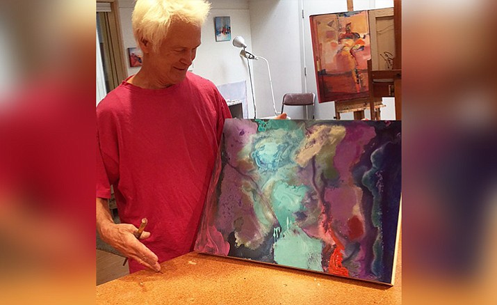 Michael Colpitts can be seen here discussing one of his paintings.
(Courtesy Photo)