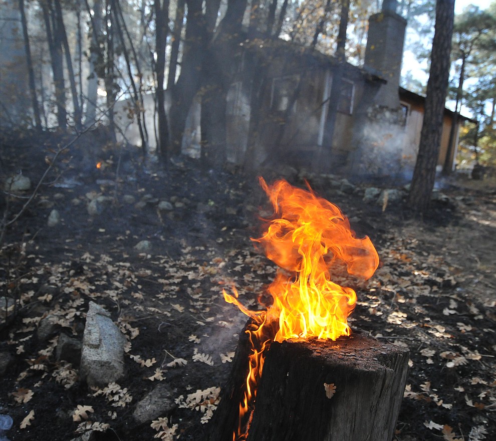 Fire crews work the one-acre Empire Fire in Groom Creek Tuesday afternoon. (Les Stukenberg/Courier)