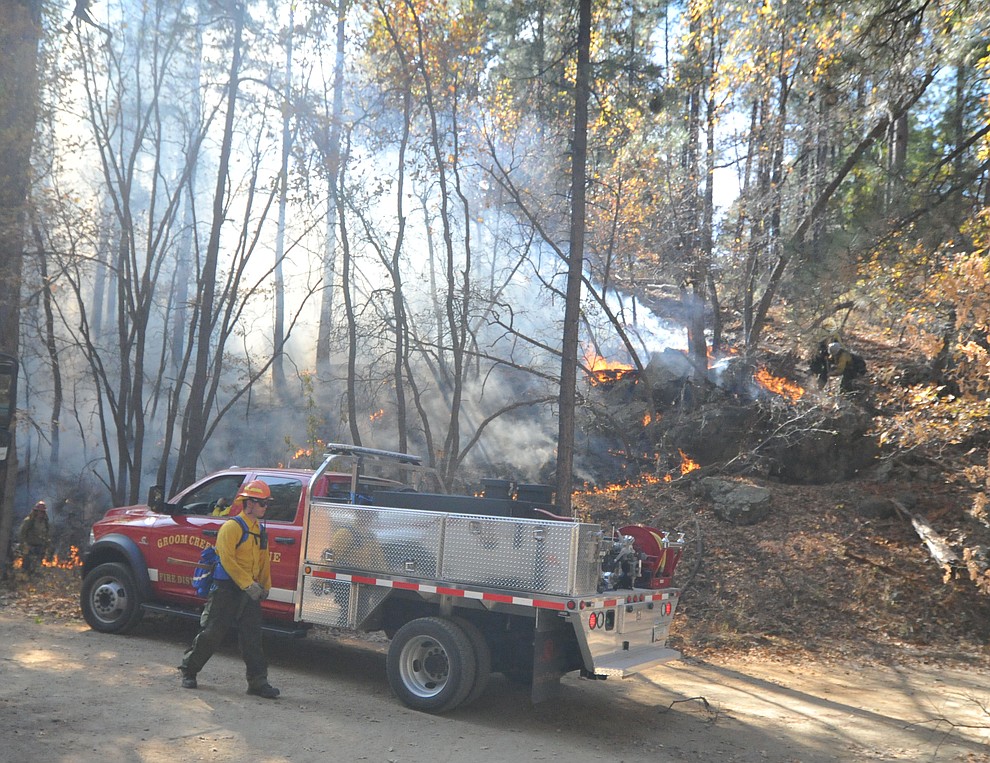 Fire crews work the one-acre Empire Fire in Groom Creek Tuesday afternoon. (Les Stukenberg/Courier)