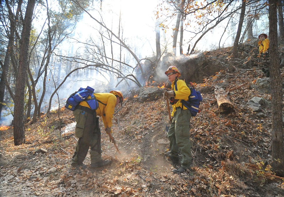 Fire crews work the one-acre Empire Fire in Groom Creek Tuesday afternoon. (Les Stukenberg/Courier)