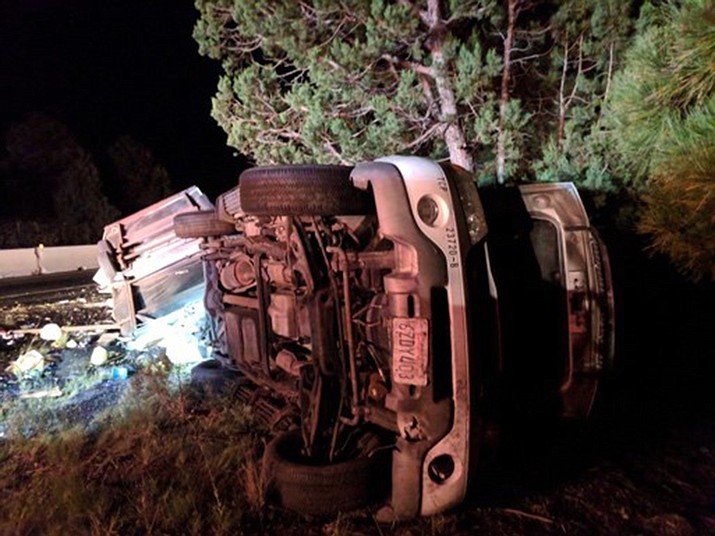  Firefighters assist with a roll-over accident on I-40 west of Williams.