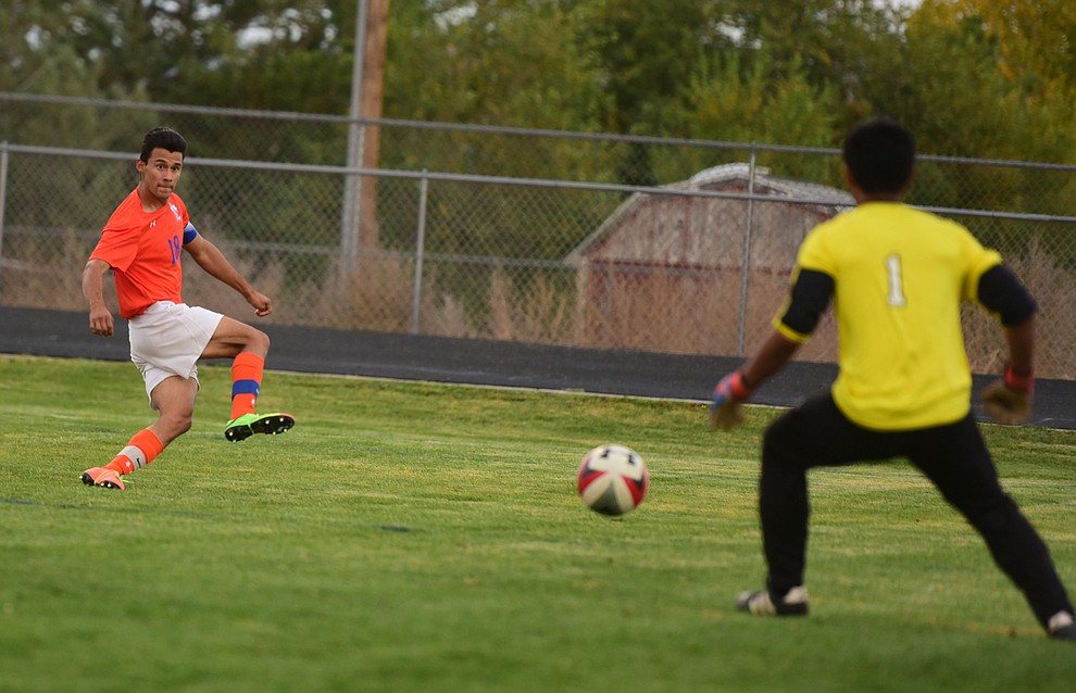 Chino Valley's Jairo Herrera (18) scores the first goal of the night as the Cougars take on the Grand Canyon Phantoms Wednesday night in Chino Valley. (Les Stukenberg/Courier)