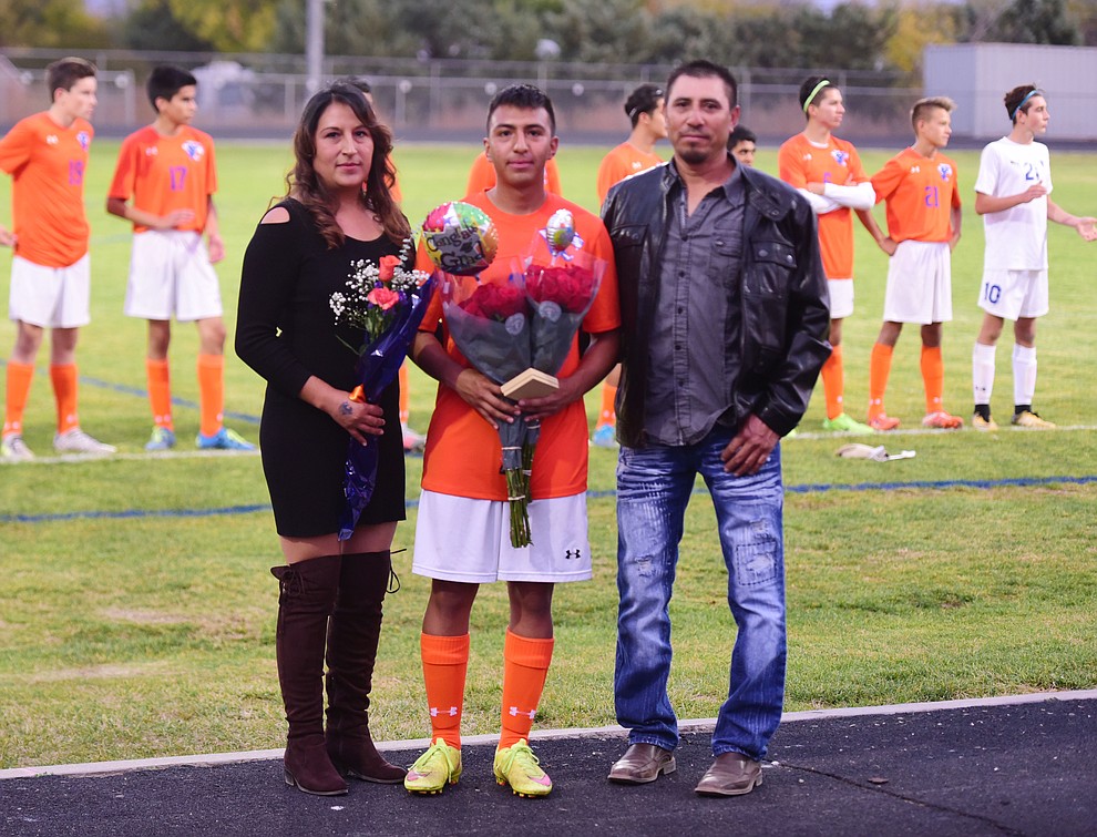 Michael Pina and his family during senior night for the Chino Valley High School Soccer Team Wednesday night. (Les Stukenberg/Courier)
