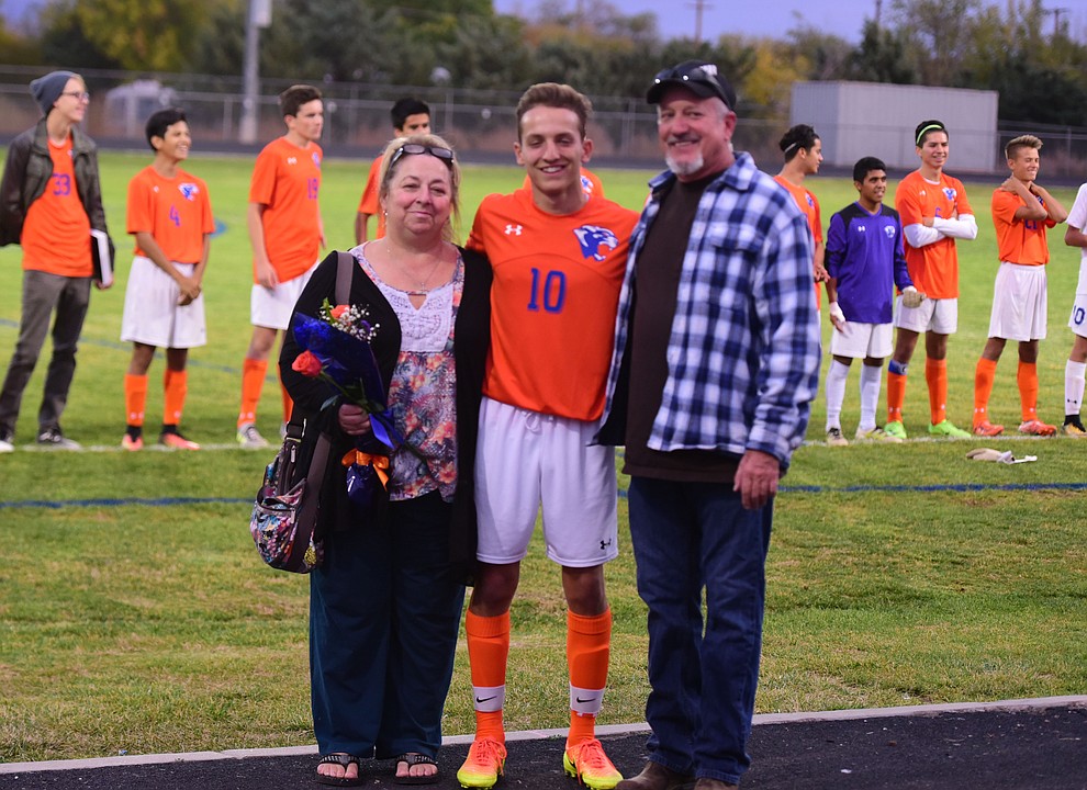 Quinn Huston and his family during senior night for the Chino Valley High School Soccer Team Wednesday night. (Les Stukenberg/Courier)