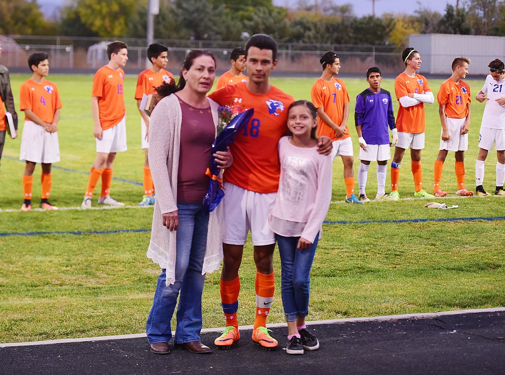 Jairo Herrera and his family during senior night for the Chino Valley High School Soccer Team Wednesday night. (Les Stukenberg/Courier)