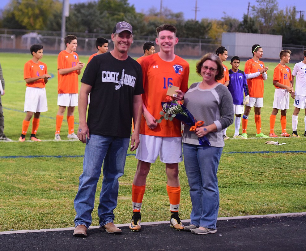 Ethan Christie and his family during senior night for the Chino Valley High School Soccer Team Wednesday night. (Les Stukenberg/Courier)