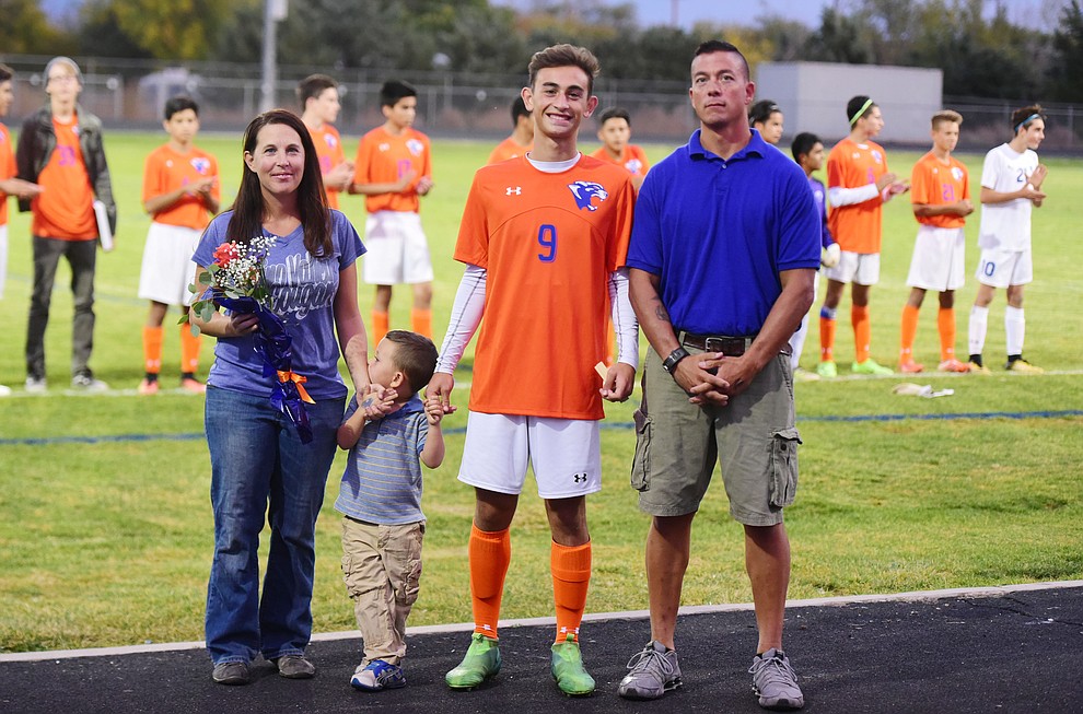 Elijah Desmond and his family during senior night for the Chino Valley High School Soccer Team Wednesday night. (Les Stukenberg/Courier)