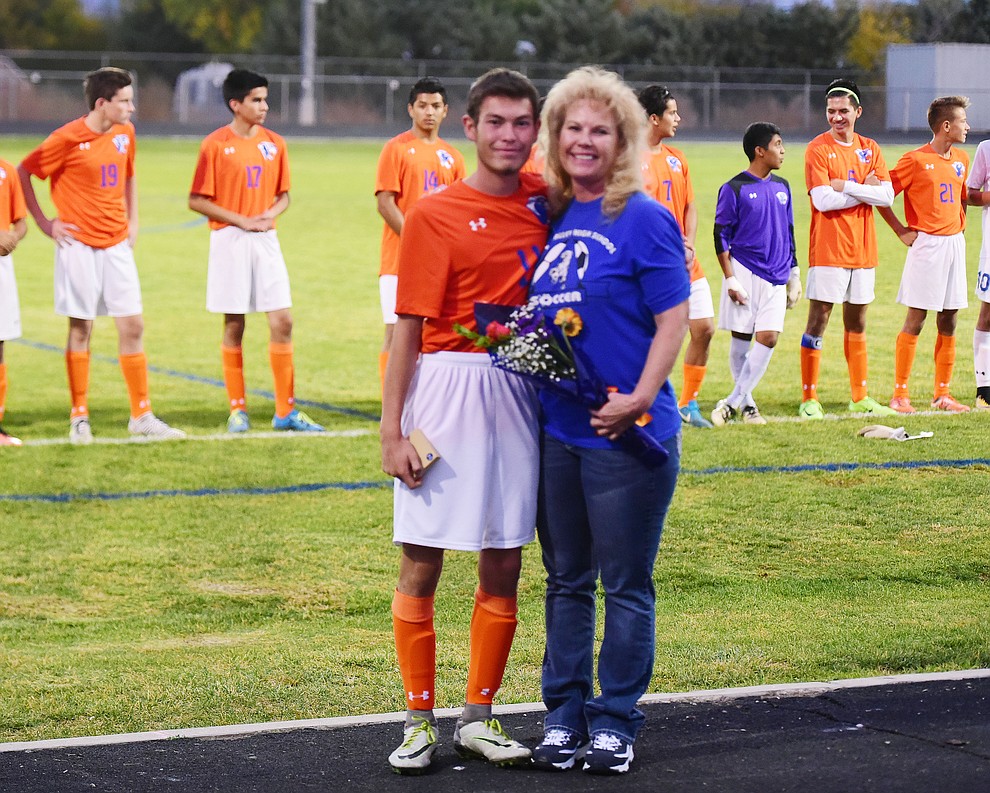 Kaleb Chacon and his mom during senior night for the Chino Valley High School Soccer Team Wednesday night. (Les Stukenberg/Courier)