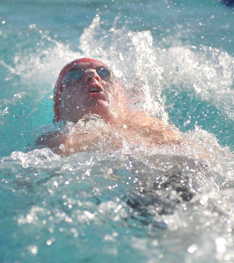 Bradshaw Mountain's Kevin Moore swims the backstroke as the Bears hosted Prescott at Mountain Valley Splash Thursday afternoon in Prescott Valley. (Les Stukenberg/Courier)