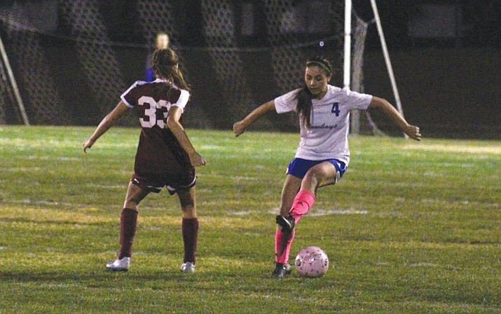 Camp Verde junior Trinity Hardy tries to evade a Northland Prep player during the Cowboys’ 3-1 loss to the Spartans. (VVN/James Kelley)