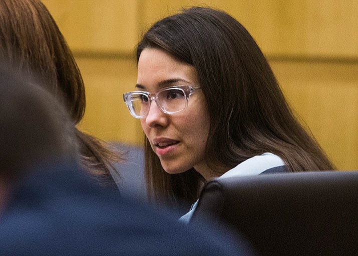 Jodi Arias looks at her defense attorney during an Aug. 13, 2014, hearing in Maricopa County Superior Court in Phoenix. Consideration of Arias’ appeal of her first-degree murder conviction for the 2008 killing of her on-again off-again boyfriend has been delayed by about a year by problems with assembling trial transcripts. (Tom Tingle /The Arizona Republic via AP, Pool, File)
