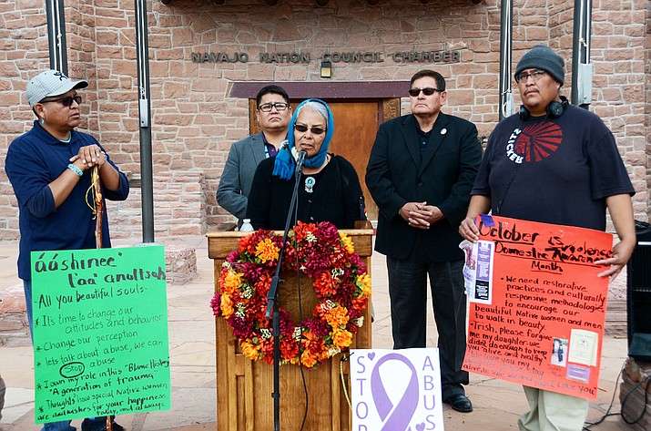 Emma Thompson, also known as “Grandma Emma” with Speaker LoRenzo Bates and Council Delegates Nathaniel Brown and Steven Begay at the Navajo Nation Council Chamber in Window Rock, Arizona Oct. 19. Thompson began her two day walk from Gallup, New Mexico Oct. 18 to bring awareness to domestic violence  on the Navajo Nation. Submitted photo