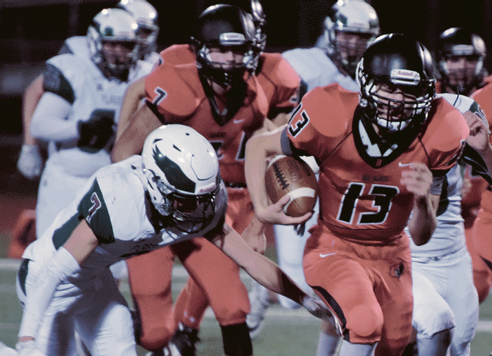 Bradshaw Mountain quarterback Austin Gonzales (13) cuts through the defense Sept. 22 in Prescott Valley. Gonzales and the Bears have a chance to claim a Grand Canyon region title tonight in Prescott. Kickoff is set for 7 p.m. (Les Stukenberg/Courier, File)