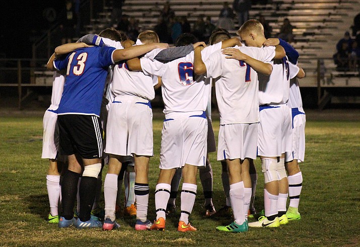 The Camp Verde boys soccer players that would partcipate in the shootout pray before it on Wednesday night. The Cowboys tied Show Low 1-1 but lost to the Cougars in the penalty kick shootout. (VVN/James Kelley)
