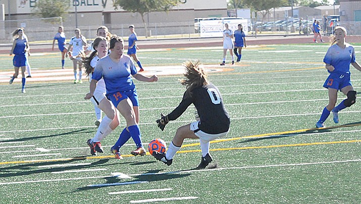 Chino Valley girls’ soccer forward Julz Elsea runs into Round Valley goalie Madi Mariscal as she drives toward the Elks’ goal in their 2A state semifinal game Friday afternoon, Oct. 27, 2017, at Campo Verde High School in Gilbert. The Cougars won the match, 3-1, to advance to the state championship match against Northland Prep today.