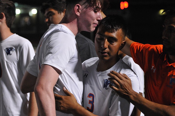 Chino Valley boys’ soccer senior midfielder Arlin Pina and senior defender Ethan Christie console each other after the Cougars lost, 1-0, to Phoenix Country Day in the 2A state semifinals Friday night, Oct. 27, 2017, at Campo Verde High School in Gilbert.