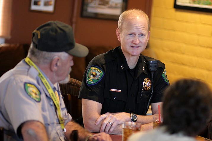 Camp Verde Commander Brian Armstrong, right, leads Monday’s Coffee with a Cop at Thanks a Latte. (Photo by Bill Helm)

