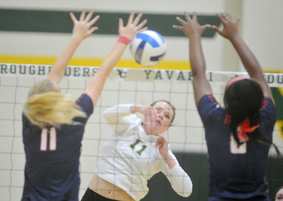Yavapai's Bailey Stephens throws down a kill as the Roughriders take on Seminole State in the NJCAA Region 1/District B semifinal game Wednesday night in Prescott. (Les Stukenberg/Courier)