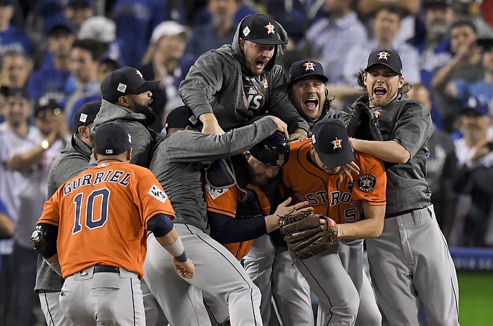 The Houston Astros celebrate after their win against the Los Angeles Dodgers in Game 7 of baseball’s World Series Wednesday, Nov. 1, in Los Angeles. The Astros won 5-1 to win the series 4-3. (Mark J. Terrill/AP)