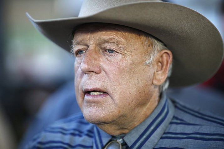 Nevada rancher Cliven Bundy speaks with supporters at a 2015 event in Bunkerville, Nev. Twice federal prosecutors in Las Vegas have failed to win full convictions of men who had guns during an April 2014 armed standoff with government agents trying to round up cattle belonging to Nevada rancher Cliven Bundy. (AP Photo/John Locher, File)
