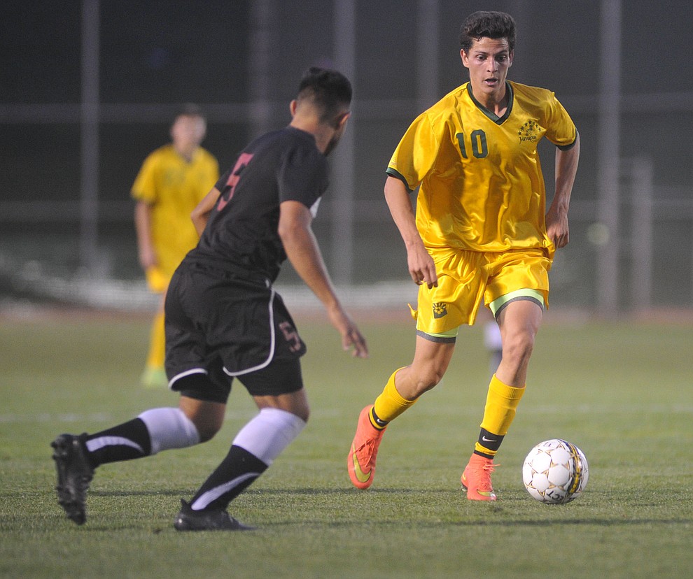 Yavapai's Carlo Quesada brings the ball upfield as the Roughriders take on Waubonsee Community College in the opening round of the NJCAA Division 1 National Championship Tuesday night in Prescott Valley. (Les Stukenberg/Courier)