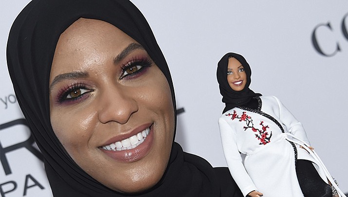 Ibtihaj Muhammad holds a Barbie doll in her likeness at the 2017 Glamour Women of the Year Awards at Kings Theatre on Monday, Nov. 13, 2017, in New York. (Photo by Evan Agostini/Invision/AP)