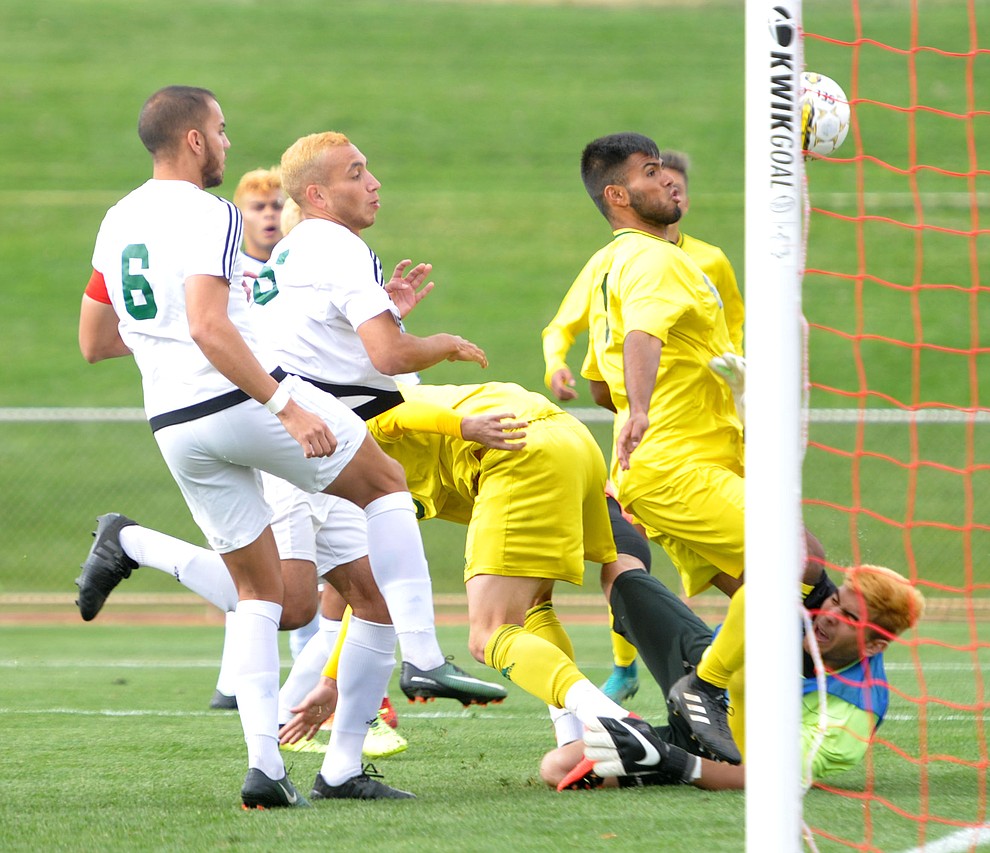 Yavapai's Ricardo Nunez-Arellano forces the action leading to the first goal as the Roughriders take on Mercer County Community College in the second round of the NJCAA Division 1 National Championship Wednesday afternoon in Prescott Valley. (Les Stukenberg/Courier)