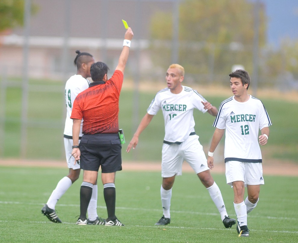 The referee hands out a yellow card to a Mercer player as the Yavapai Roughriders take on Mercer County Community College in the second round of the NJCAA Division 1 National Championship Wednesday afternoon in Prescott Valley. (Les Stukenberg/Courier)