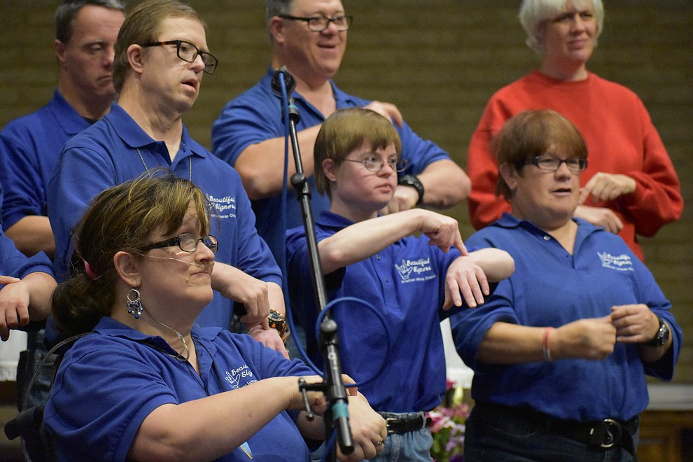The "Beautiful Singers" sign language choir from American Lutheran Church perform during the 2017 Celebration of Thanks at Sacred Heart Church in Prescott. (Richard Haddad/WNI)
