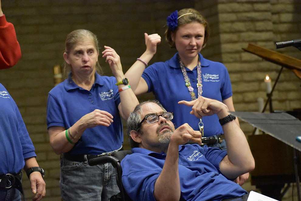 The "Beautiful Singers" sign language choir from American Lutheran Church perform during the 2017 Celebration of Thanks at Sacred Heart Church in Prescott. (Richard Haddad/WNI)