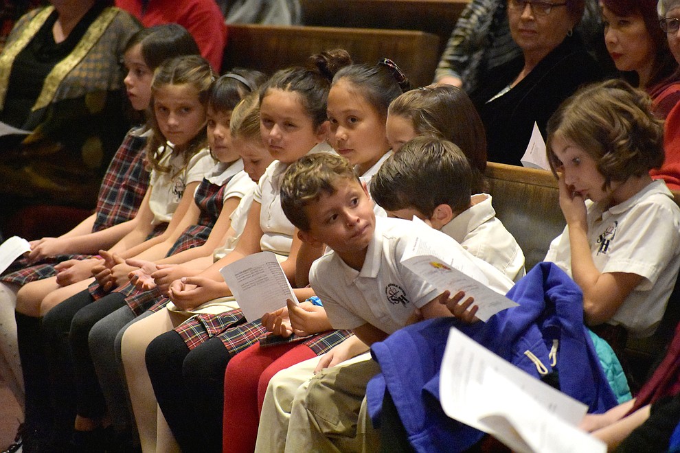 A children's choir from Sacred Heart Church waits to perform during the 2017 Celebration of Thanks concert sponsored by the Quad City Interfaith Council. (Richard Haddad/WNI)