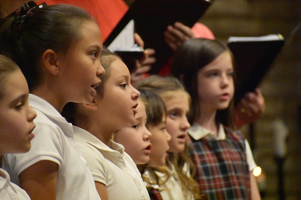 The Sacred Heart Choirs perform during the 2017 Celebration of Thanks concert sponsored by the Quad City Interfaith Council. (Richard Haddad/WNI)