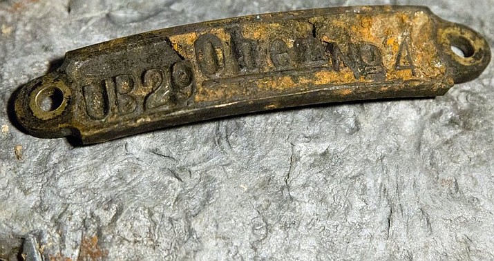 A plate recovered from the torpedo cabin of a World War I German submarine, identifying it as UB-29, is on exhibit for the media in Brugge, Belgium, Tuesday, Nov. 14, 2017. An intact German First World War submarine containing the bodies of the crew was found over the summer off the coast of Belgium and has now been formally identified as UB-29. (AP Photo/Virginia Mayo)