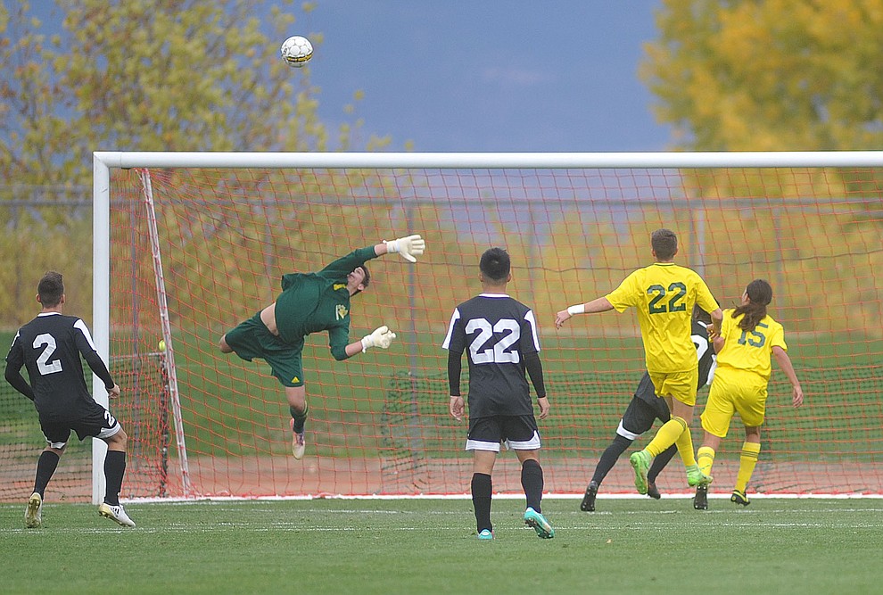 Yavapai goalkeeper Tyler Trump makes a save as the Roughriders take on Tyler Community College in the semifinals of the NJCAA Division 1 Men's National Championship in Prescott Valley Friday afternoon. (Les Stukenberg/Courier)